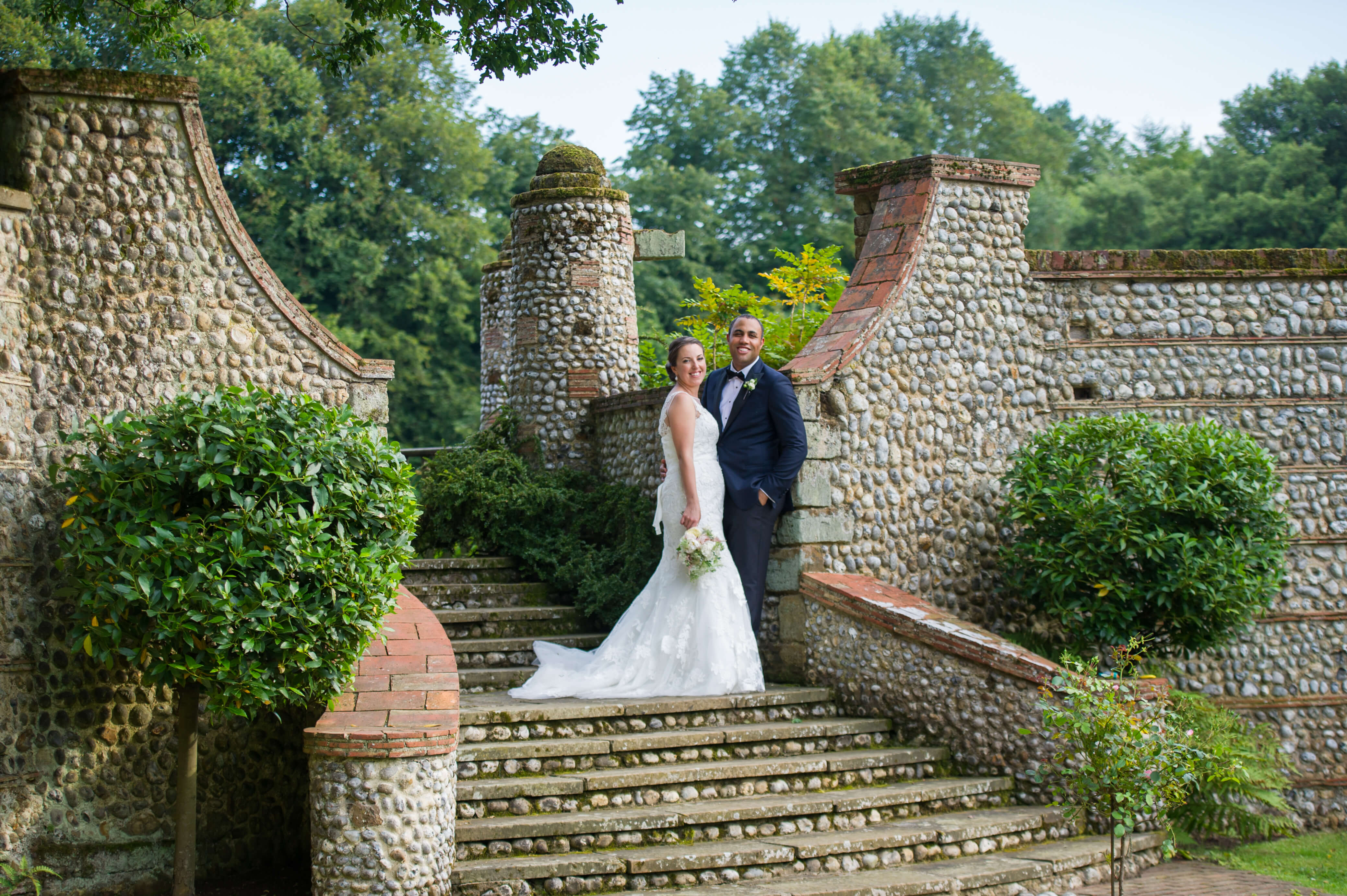 A newly married couple having their wedding photography in the gardens of Voewood House 